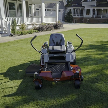 Exmark Quest E-Series Residential zero-turn mower on lawn in front of a home