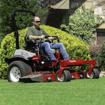 Lawn professional mowing lawn with a Lazer Z X-Series zero-turn mower