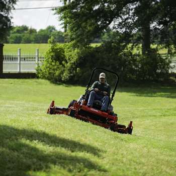 Lawn professional mowing on a slope with a Lazer Z X Series